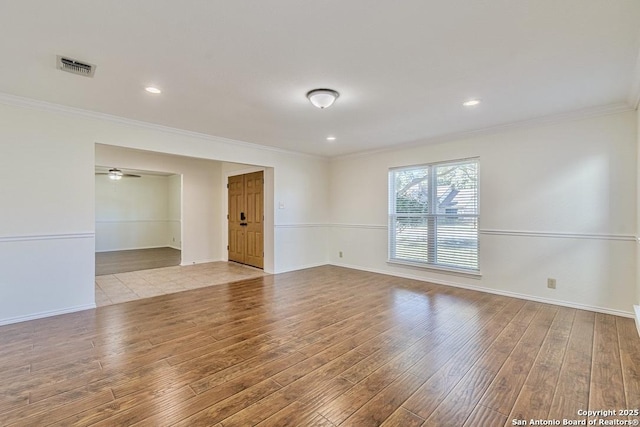 unfurnished room featuring ornamental molding, ceiling fan, and light hardwood / wood-style floors