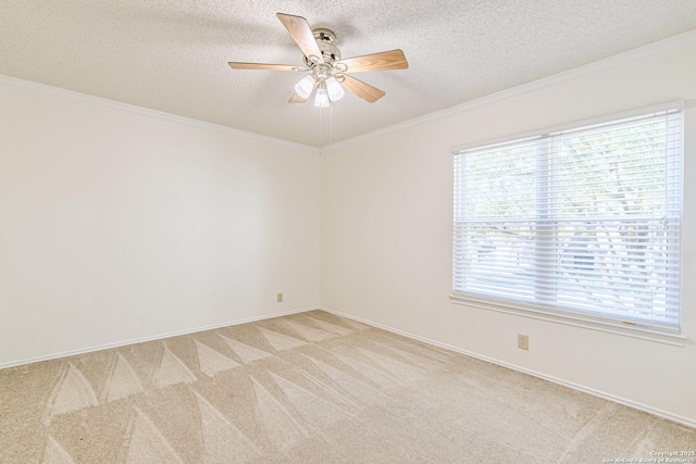 carpeted spare room featuring a textured ceiling, ceiling fan, and ornamental molding