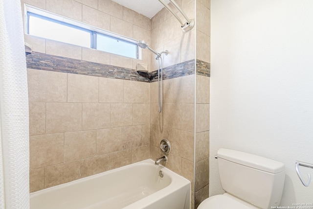 bathroom with shower / tub combo with curtain and toilet