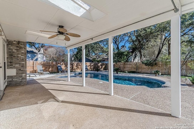 view of pool with a patio area and ceiling fan