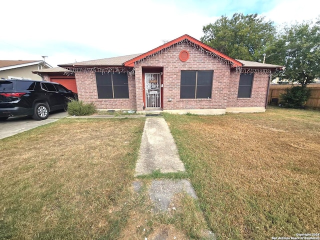 ranch-style house with a front lawn