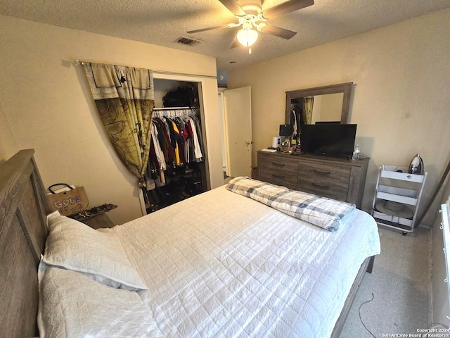 bedroom with a closet, ceiling fan, and a textured ceiling