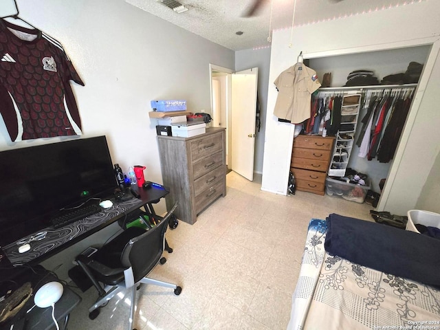 interior space featuring a closet and a textured ceiling