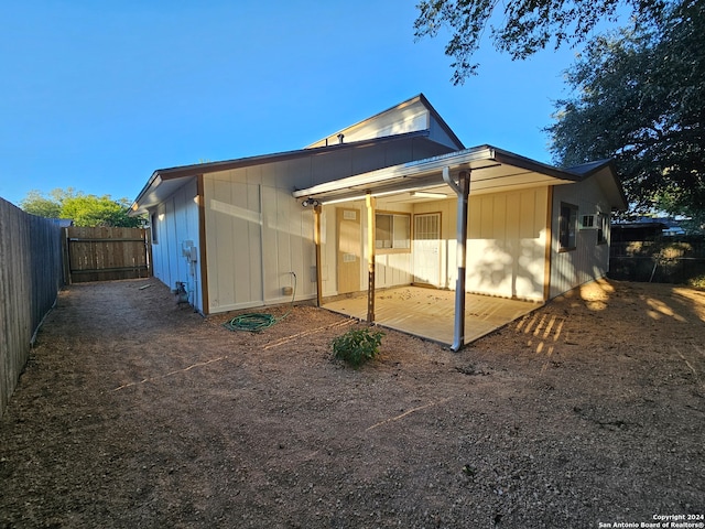 rear view of property featuring a patio area