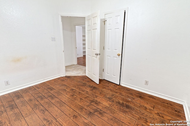 empty room featuring dark hardwood / wood-style floors