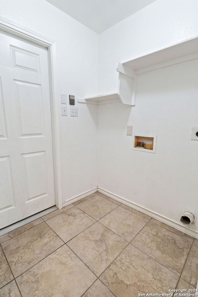 laundry area with electric dryer hookup, washer hookup, and light tile patterned floors