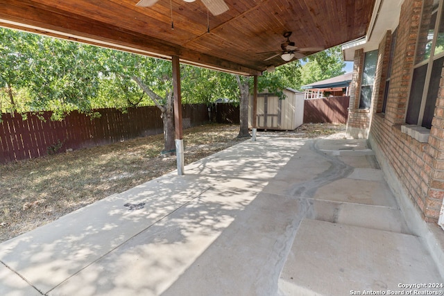 view of patio featuring a shed and ceiling fan