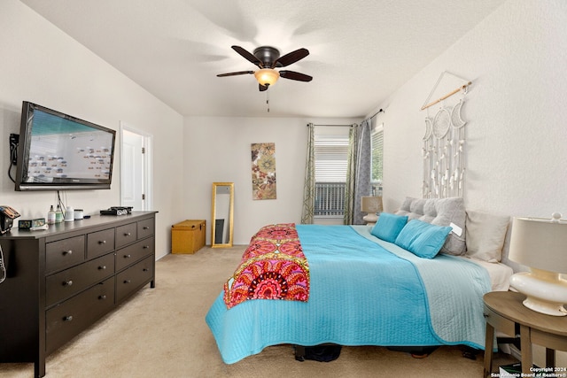 bedroom featuring light colored carpet and ceiling fan