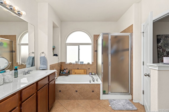 bathroom featuring plus walk in shower and plenty of natural light