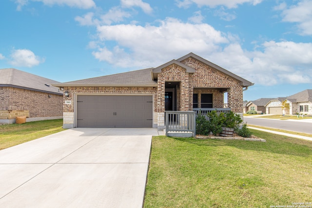 view of front of property featuring a porch, a garage, and a front lawn