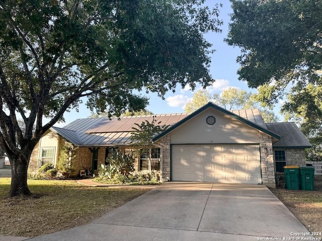 ranch-style house featuring a garage