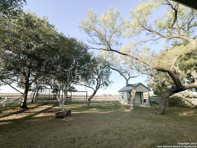 view of yard with a rural view