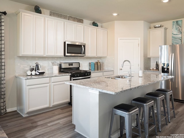 kitchen with white cabinetry, sink, and appliances with stainless steel finishes