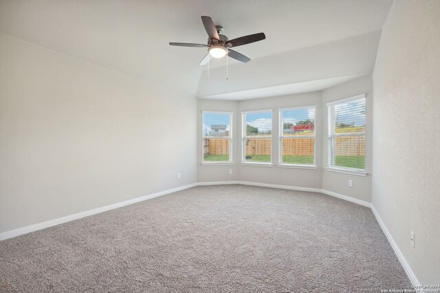 carpeted spare room with ceiling fan