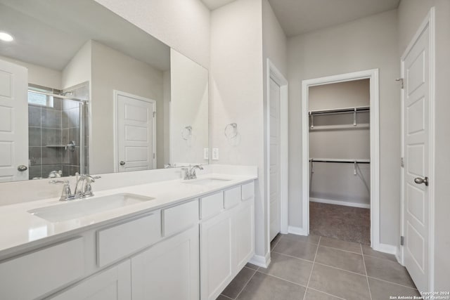 bathroom with vanity, tile patterned floors, and walk in shower