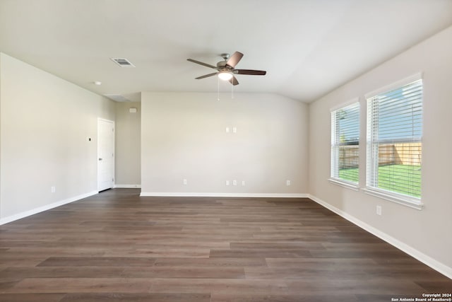 spare room featuring ceiling fan, dark hardwood / wood-style flooring, and lofted ceiling