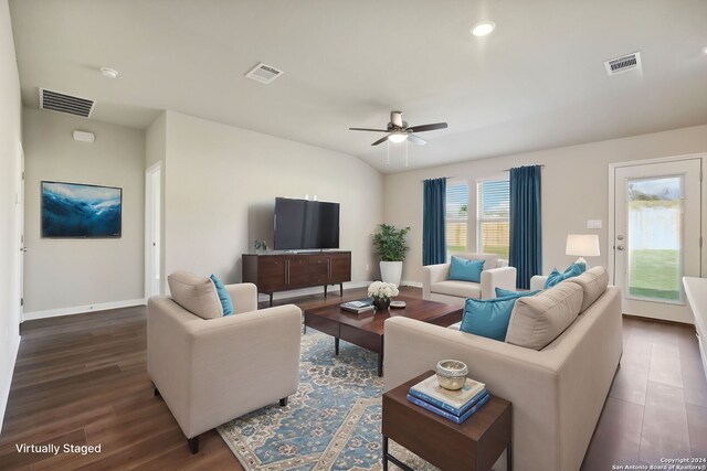 living room with ceiling fan and dark hardwood / wood-style floors