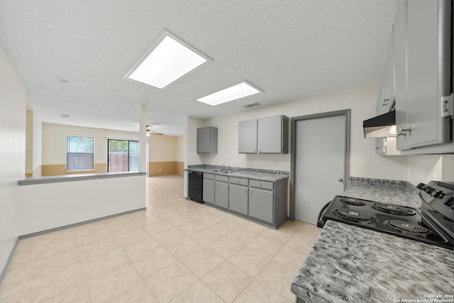 kitchen with gray cabinetry, sink, black appliances, and a textured ceiling