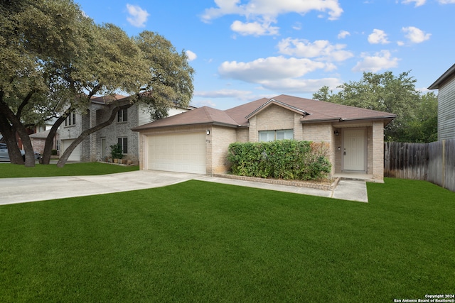 view of front facade featuring a garage and a front lawn