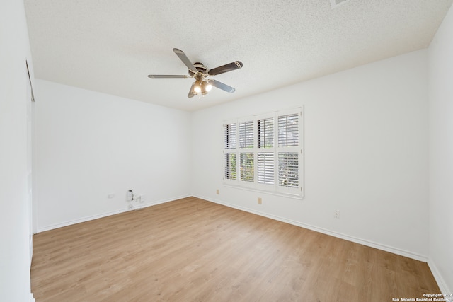 unfurnished room featuring ceiling fan, a textured ceiling, and light hardwood / wood-style floors