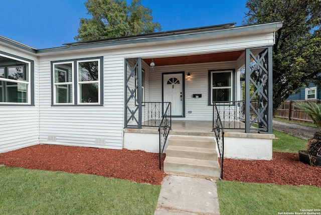 307 Bexar Dr, San Antonio, TX 78228 - view of front of home with fence, covered porch, and crawl space