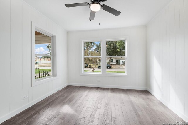 307 Bexar Dr, San Antonio, TX 78228 - empty room with healthy amount of natural light, wood finished floors, and a ceiling fan