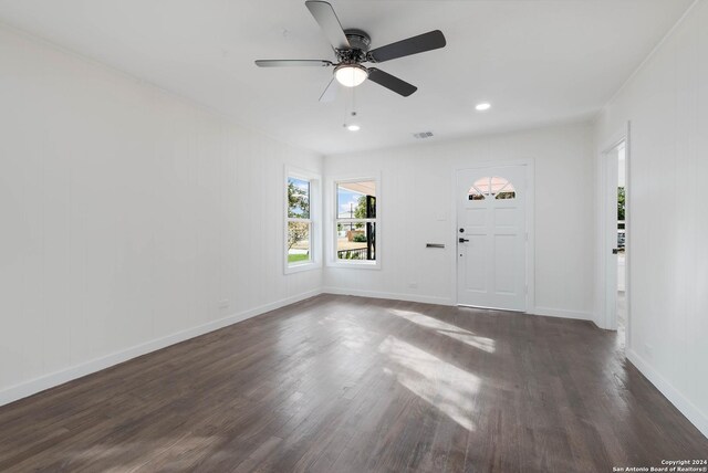 307 Bexar Dr, San Antonio, TX 78228 - unfurnished living room with dark wood-style floors, ceiling fan, recessed lighting, and baseboards