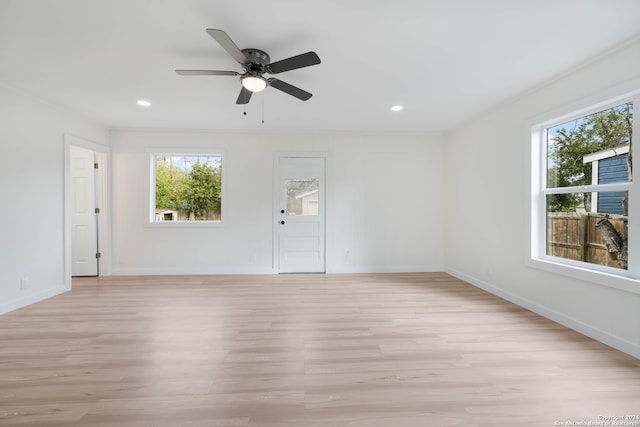 spare room with light hardwood / wood-style floors and ceiling fan