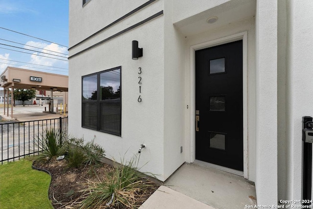 3214 N Elmendorf St, San Antonio, TX 78201 - view of exterior entry featuring stucco siding