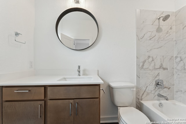 full bathroom with toilet, tiled shower / bath combo, and vanity