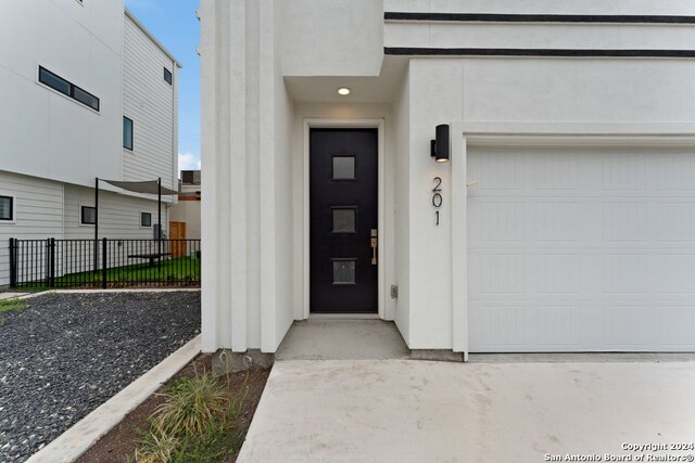 doorway to property with a garage