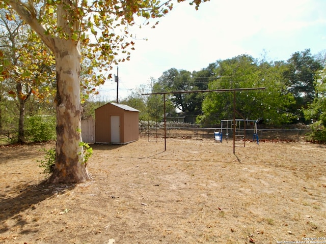 view of yard featuring a shed and a playground