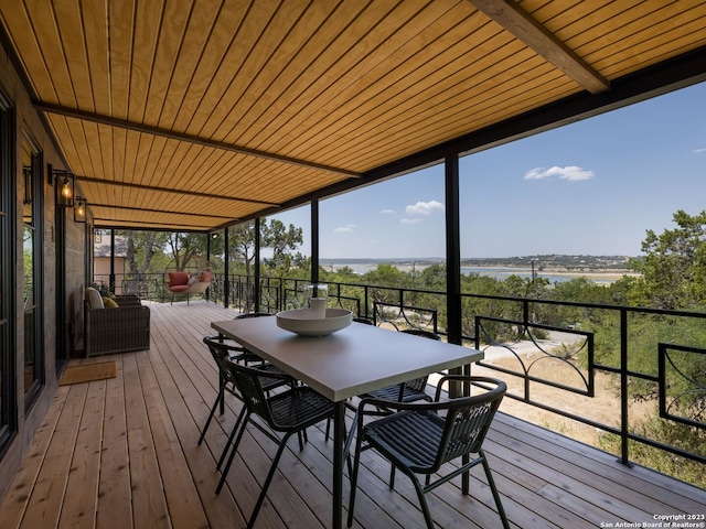 wooden deck with a water view