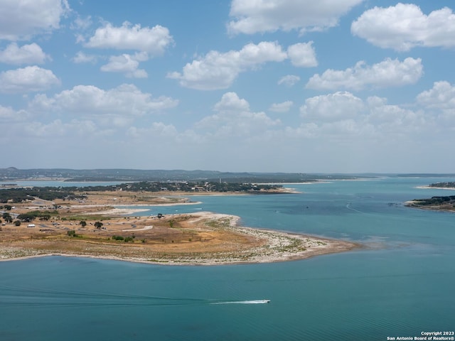 bird's eye view featuring a view of the beach and a water view