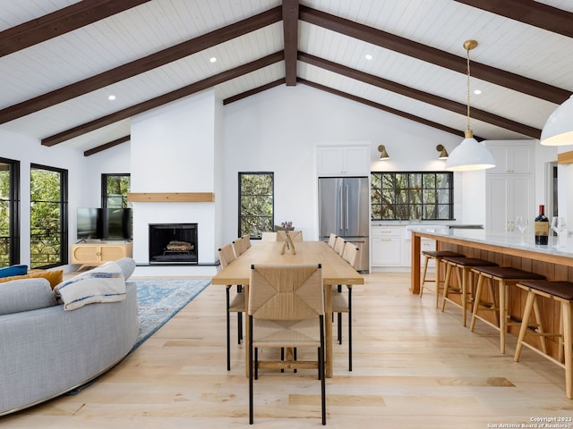 1941 Lakeshore Dr, Canyon Lake, TX 78133 - dining area with a fireplace with raised hearth, high vaulted ceiling, wooden ceiling, beamed ceiling, and healthy amount of natural light