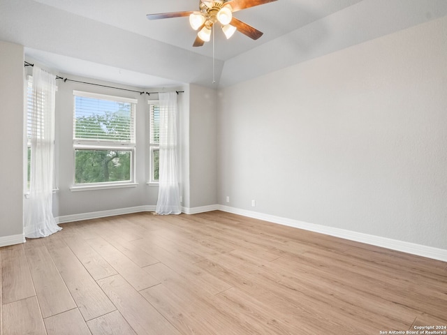 unfurnished room with light wood-type flooring and ceiling fan