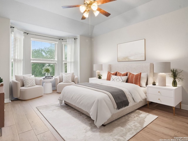 bedroom with ceiling fan and light hardwood / wood-style floors