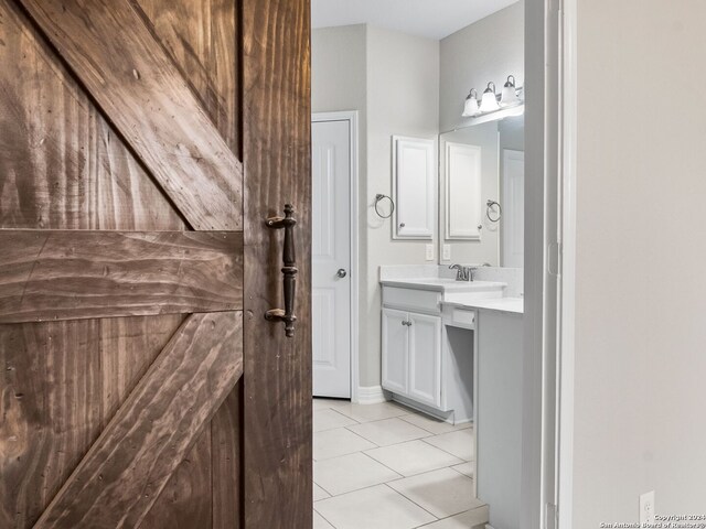 bathroom with vanity and tile patterned floors