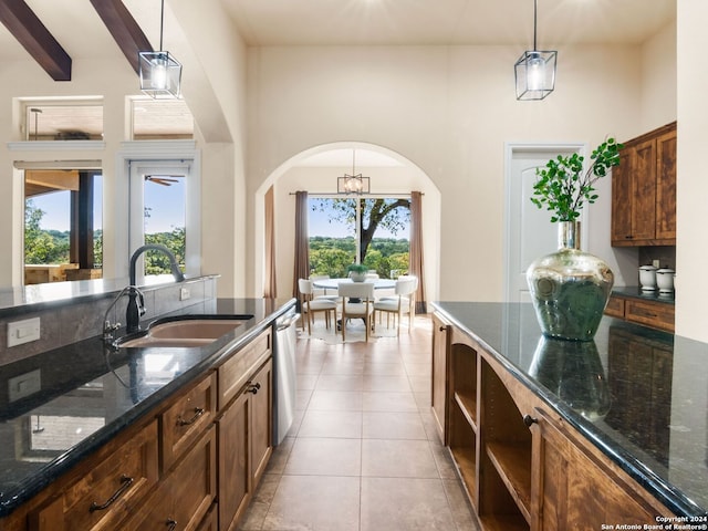 kitchen featuring plenty of natural light, sink, and decorative light fixtures