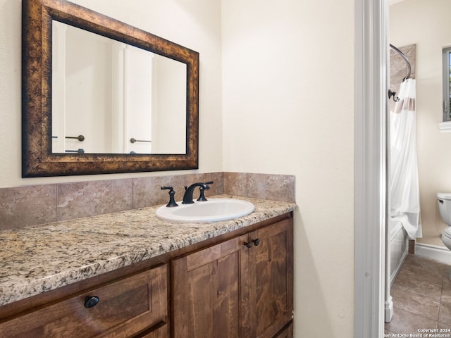 full bathroom featuring toilet, shower / tub combo with curtain, vanity, and tile patterned floors