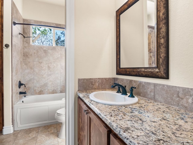 full bathroom with tile patterned flooring, vanity, toilet, and tiled shower / bath