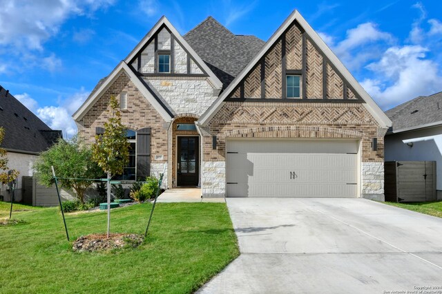 323 Sugarcane, New Braunfels, TX 78132 - tudor home with stone siding, brick siding, driveway, and a front yard