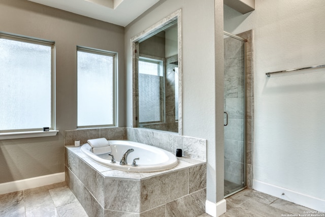 bathroom with separate shower and tub