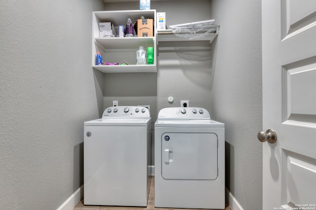 clothes washing area featuring washing machine and clothes dryer