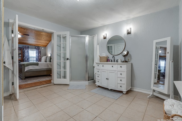 bathroom with vanity, french doors, ceiling fan, and a shower with shower door