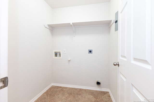 laundry room with hookup for a washing machine, electric dryer hookup, hookup for a gas dryer, and light tile patterned floors