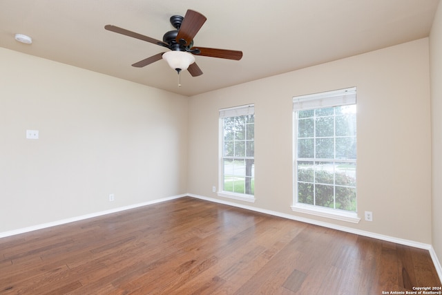 unfurnished room featuring hardwood / wood-style flooring and ceiling fan