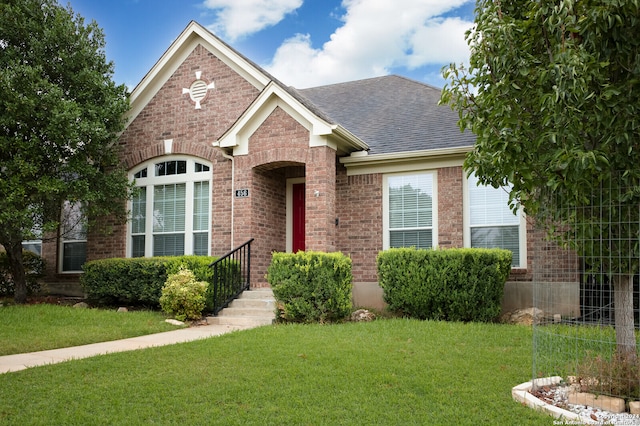 view of front of home with a front lawn