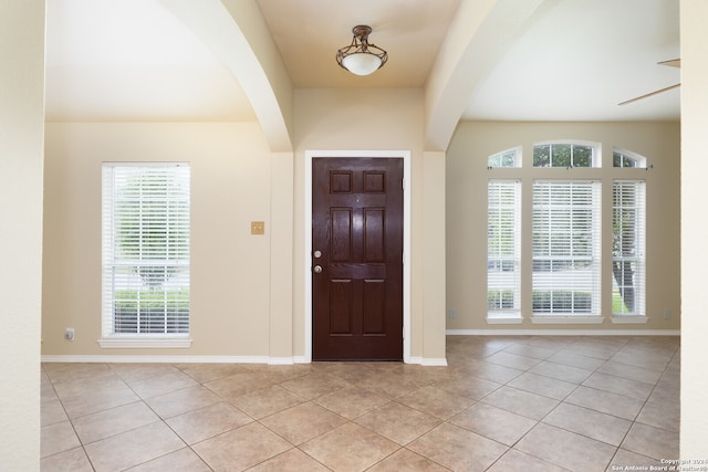 tiled entryway with plenty of natural light