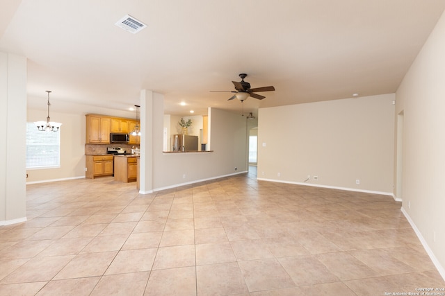 unfurnished living room featuring ceiling fan with notable chandelier and light tile patterned floors